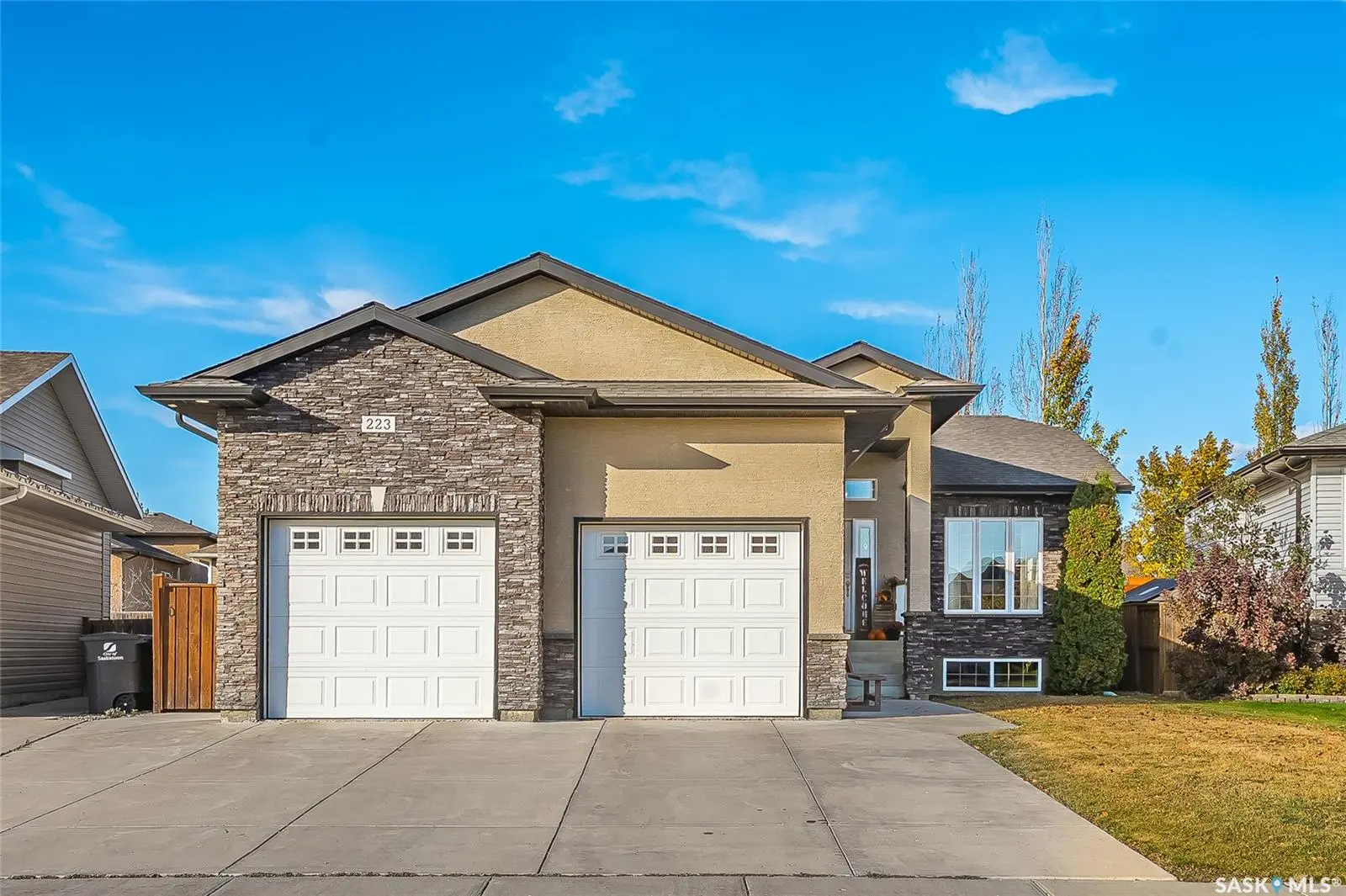 Exterior photo of 223 Greenfield Crescent Saskatoon SK, a bungalow with attached garage in Hampton Village